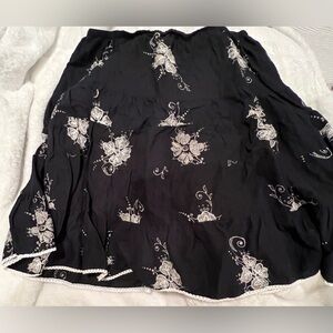 Beautiful Black Boho skirt with cream embroidery of flowers.